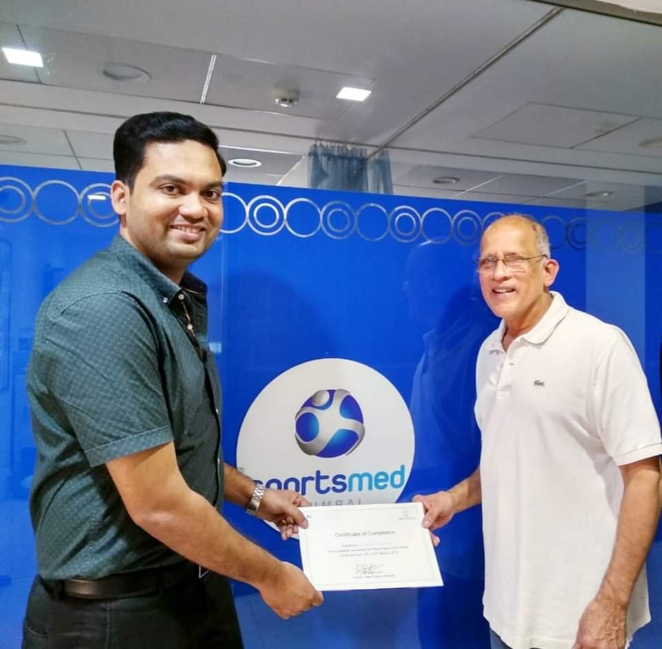 Dr. Althaaf receiving SportsMed Certificate of Completion